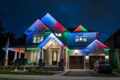 Image of front of home with permanent holiday lighting installed by Martin Construction Services